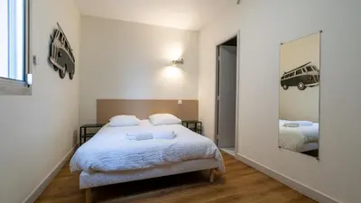 Un ou plusieurs lits dans un hébergement de l'établissement Hôtel Des Docks