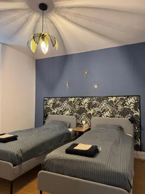 Un ou plusieurs lits dans un hébergement de l'établissement Charmante maison bourguignonne avec grand jardin et parking