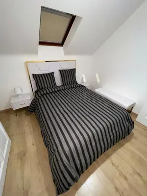 Un ou plusieurs lits dans un hébergement de l'établissement Luxury suites maladiere 1