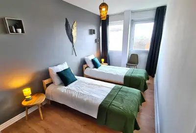 Un ou plusieurs lits dans un hébergement de l'établissement Appartement Mâcon Centre T4 - 100m2