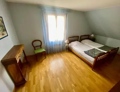 Un ou plusieurs lits dans un hébergement de l'établissement Maison familiale dans village viticole