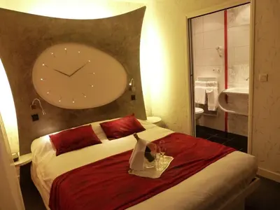 Un ou plusieurs lits dans un hébergement de l'établissement Domaine du Revermont - Logis Hotel