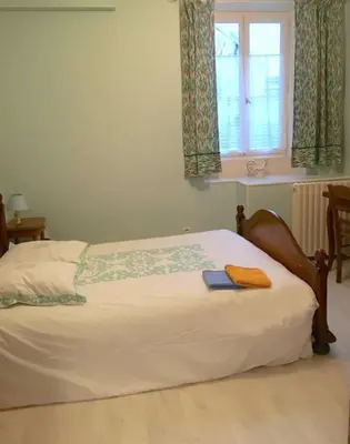 Un ou plusieurs lits dans un hébergement de l'établissement Appartement Grand-duc