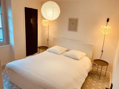 Un ou plusieurs lits dans un hébergement de l'établissement Suite 24 Appart'hôtel-L'Annexe-3 étoiles