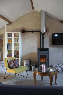 Coin salon dans l'établissement Gite calme et cosy, toutes commodités et tourisme