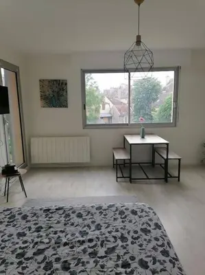 Un ou plusieurs lits dans un hébergement de l'établissement Le Tivoli - Balcon Vue jardin