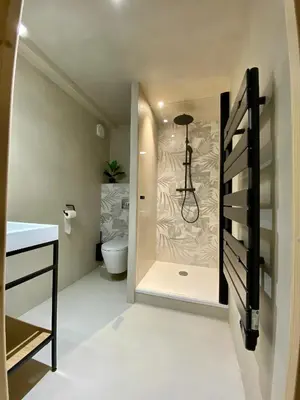 Un ou plusieurs lits dans un hébergement de l'établissement LE STUDIO,Superbe appartement meublé avec terrasse
