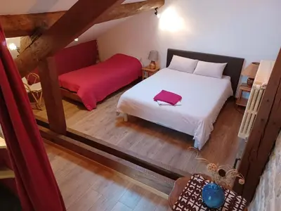 Un ou plusieurs lits dans un hébergement de l'établissement 2 chambres au calme à la Maison des Bambous