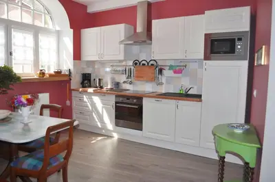 Cuisine ou kitchenette dans l'établissement Moulin de Merzé