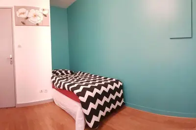 Un ou plusieurs lits dans un hébergement de l'établissement Studio de 12m² agréable calme proche CHU