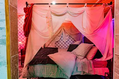 Un ou plusieurs lits dans un hébergement de l'établissement Le Néflier Dijon - appart balnéo - SPA romantique pour 2