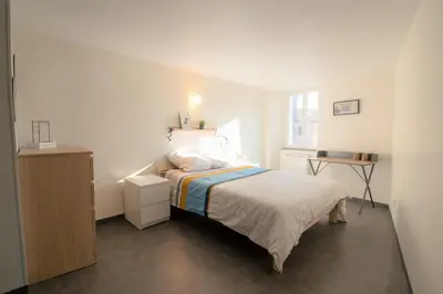 Un ou plusieurs lits dans un hébergement de l'établissement CABANA & Duplex - Cluny à 20 minutes