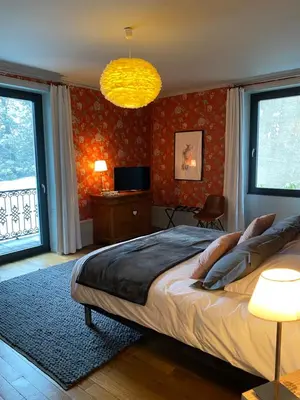Un ou plusieurs lits dans un hébergement de l'établissement Chambres d’hôtes Les Mouillères