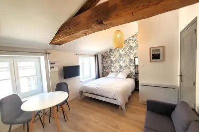 Un ou plusieurs lits dans un hébergement de l'établissement L'IDYLLE - Studio Cocooning avec Jacuzzi