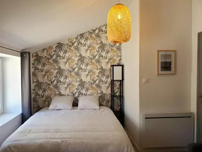 Un ou plusieurs lits dans un hébergement de l'établissement L'IDYLLE - Studio Cocooning avec Jacuzzi