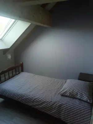 Un ou plusieurs lits dans un hébergement de l'établissement Gîte au bord de la rivière