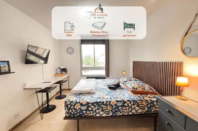 Un ou plusieurs lits dans un hébergement de l'établissement Les Logis de Paray Appartement 201
