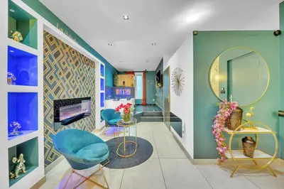 Télévision ou salle de divertissement dans l'établissement Aphrodite suite de prestige