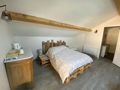 Un ou plusieurs lits dans un hébergement de l'établissement Chambre privative chez Toutoune