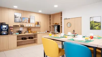 Cuisine ou kitchenette dans l'établissement Residhome Dijon Cité Des Vignes