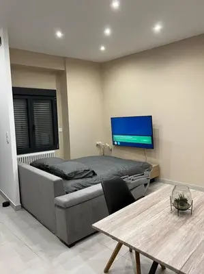 Télévision ou salle de divertissement dans l'établissement Belle appartement avec parking gratuit