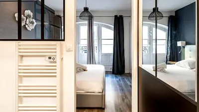 Un ou plusieurs lits dans un hébergement de l'établissement L'Escapade Urbaine - Cosy et central