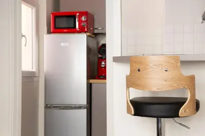 Cuisine ou kitchenette dans l'établissement L'Escapade Urbaine - Cosy et central