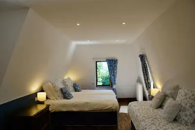Un ou plusieurs lits dans un hébergement de l'établissement Maison de la Tour