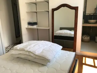 Un ou plusieurs lits dans un hébergement de l'établissement Superbe T2 en bords de Saône