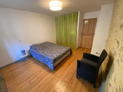 Un ou plusieurs lits dans un hébergement de l'établissement Gîte de la tour de Paradis