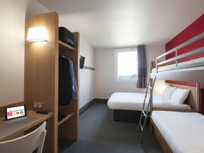 Un ou plusieurs lits dans un hébergement de l'établissement B&B HOTEL Paray-le-Monial