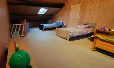 Un ou plusieurs lits dans un hébergement de l'établissement Gite du Hameau