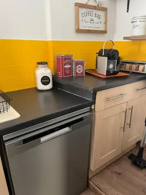 Cuisine ou kitchenette dans l'établissement Maison cosy en plein centre ville