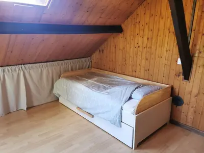 Un ou plusieurs lits dans un hébergement de l'établissement Studio Duplex avec jardin - La voie des Salines