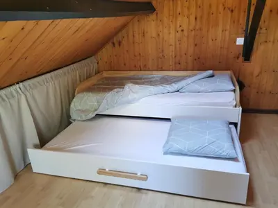 Un ou plusieurs lits dans un hébergement de l'établissement Studio Duplex avec jardin - La voie des Salines