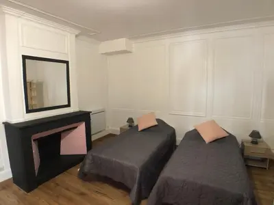 Un ou plusieurs lits dans un hébergement de l'établissement Gîte Raisin Rose