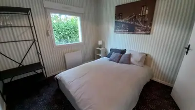 Un ou plusieurs lits dans un hébergement de l'établissement Studio Privé Dijon