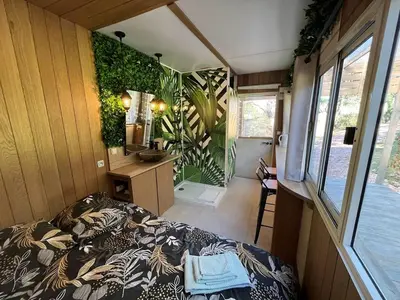 Un ou plusieurs lits dans un hébergement de l'établissement La Cabane Du Champ Du Possible