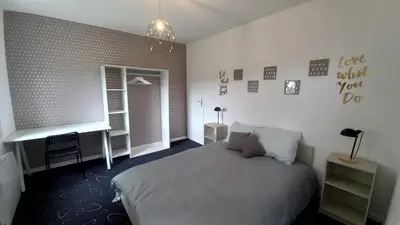 Un ou plusieurs lits dans un hébergement de l'établissement Adorable studio avec entrée indépendante