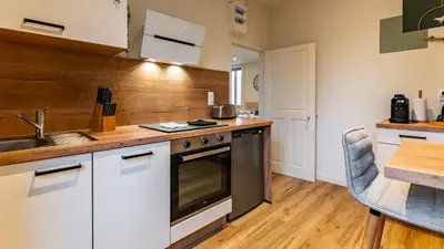 Cuisine ou kitchenette dans l'établissement Le Cocon d'Anna