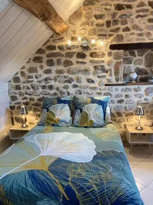 Un ou plusieurs lits dans un hébergement de l'établissement L’Atelier de la Forge L’enclume
