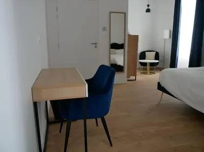 Un ou plusieurs lits dans un hébergement de l'établissement Clos de la Providence, gîte, piscine et Spa 3 chambres