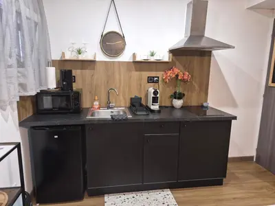 Cuisine ou kitchenette dans l'établissement Cosy Corner - Appartement spa - Jacuzzi
