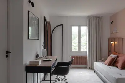 Un ou plusieurs lits dans un hébergement de l'établissement Hôtel Le Prieuré