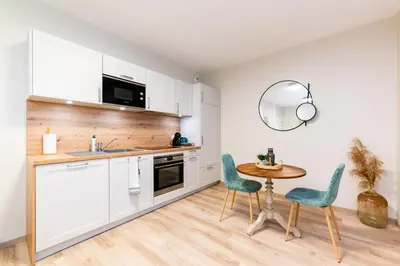 Cuisine ou kitchenette dans l'établissement Les coursives appartements
