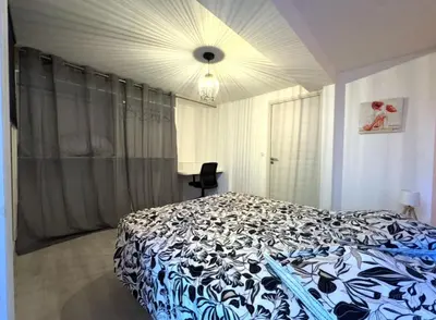 Un ou plusieurs lits dans un hébergement de l'établissement Superbe appartement avec parking gratuit