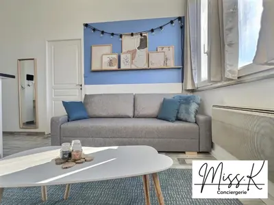 Coin salon dans l'établissement L'Héritan de Miss.K Conciergerie