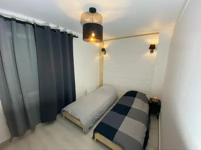 Un ou plusieurs lits dans un hébergement de l'établissement Le Pasteur Duplex Confort Centre Ville