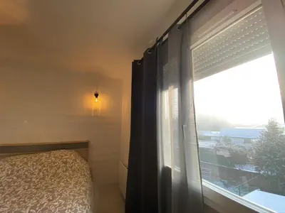 Un ou plusieurs lits dans un hébergement de l'établissement Le Pasteur Duplex Confort Centre Ville