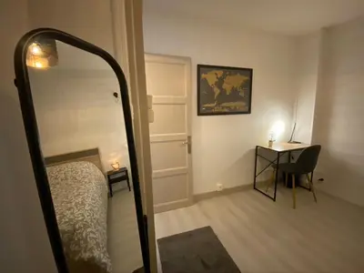 Un ou plusieurs lits dans un hébergement de l'établissement Le Pasteur Duplex Confort Centre Ville